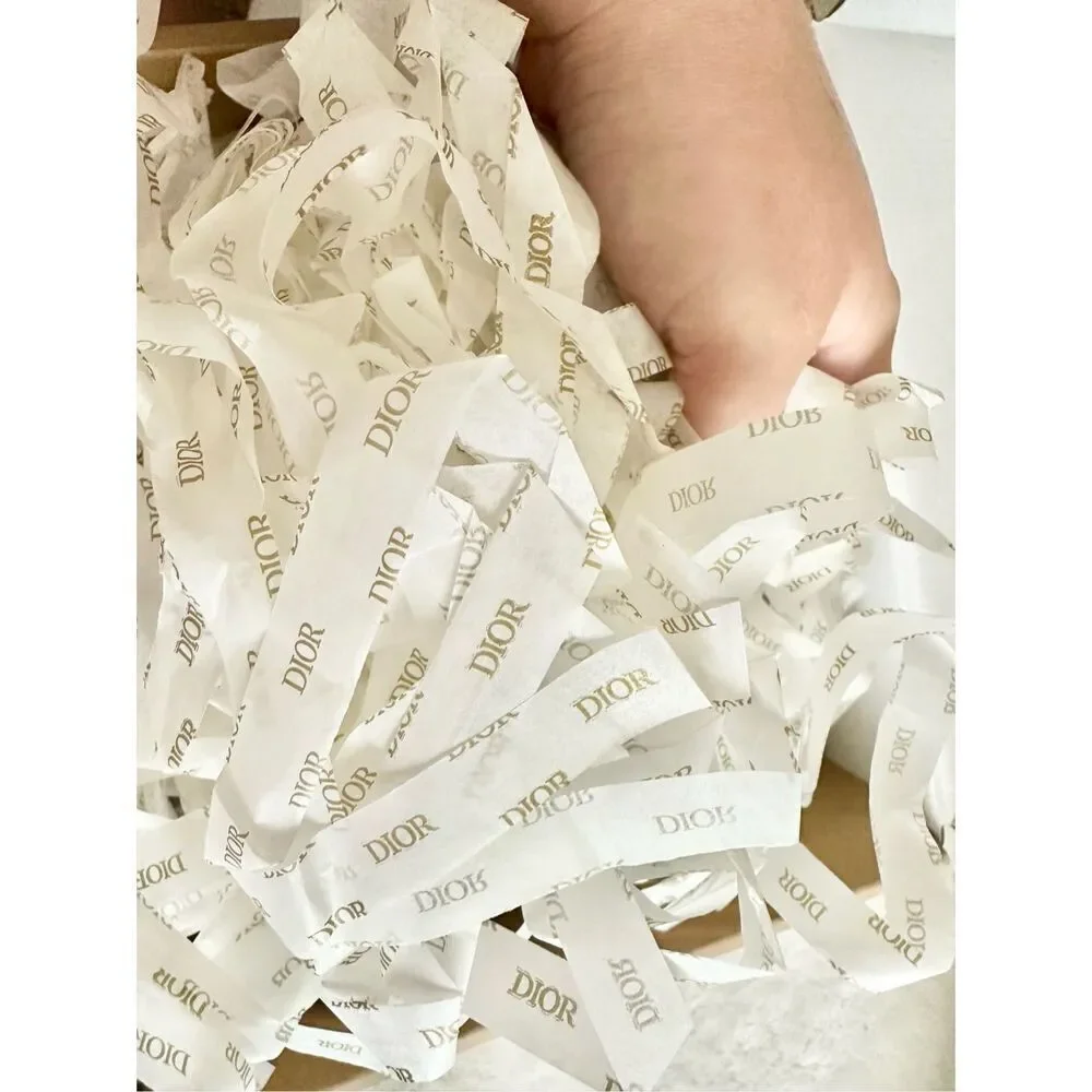 Handful of Dior shredded tissue paper ￼